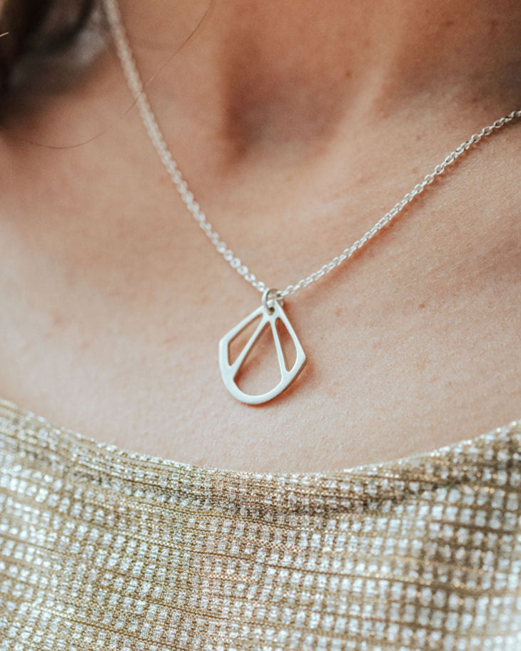 Sterling silver, geometric shell shaped art deco style pendant.