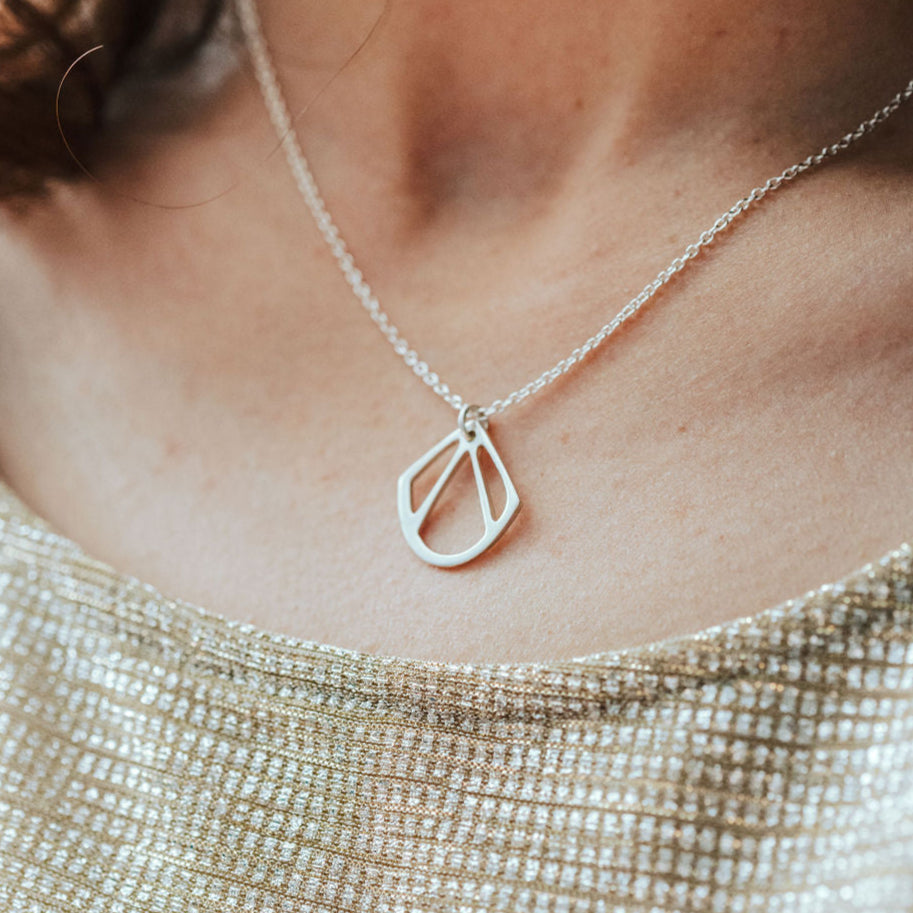 Sterling silver, geometric shell shaped art deco style pendant.