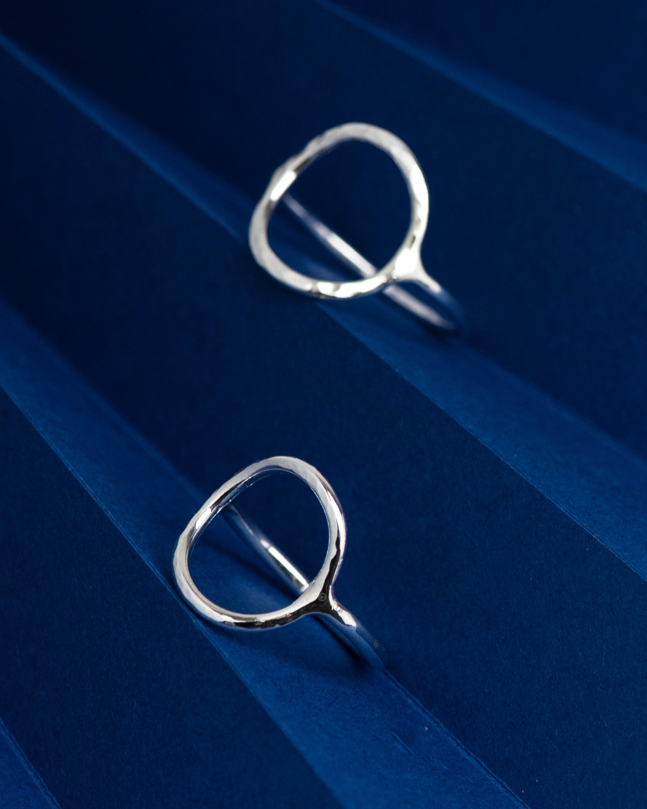 Textured open circle rings in silver. Designed and handmade by Hannah Weston, UK.