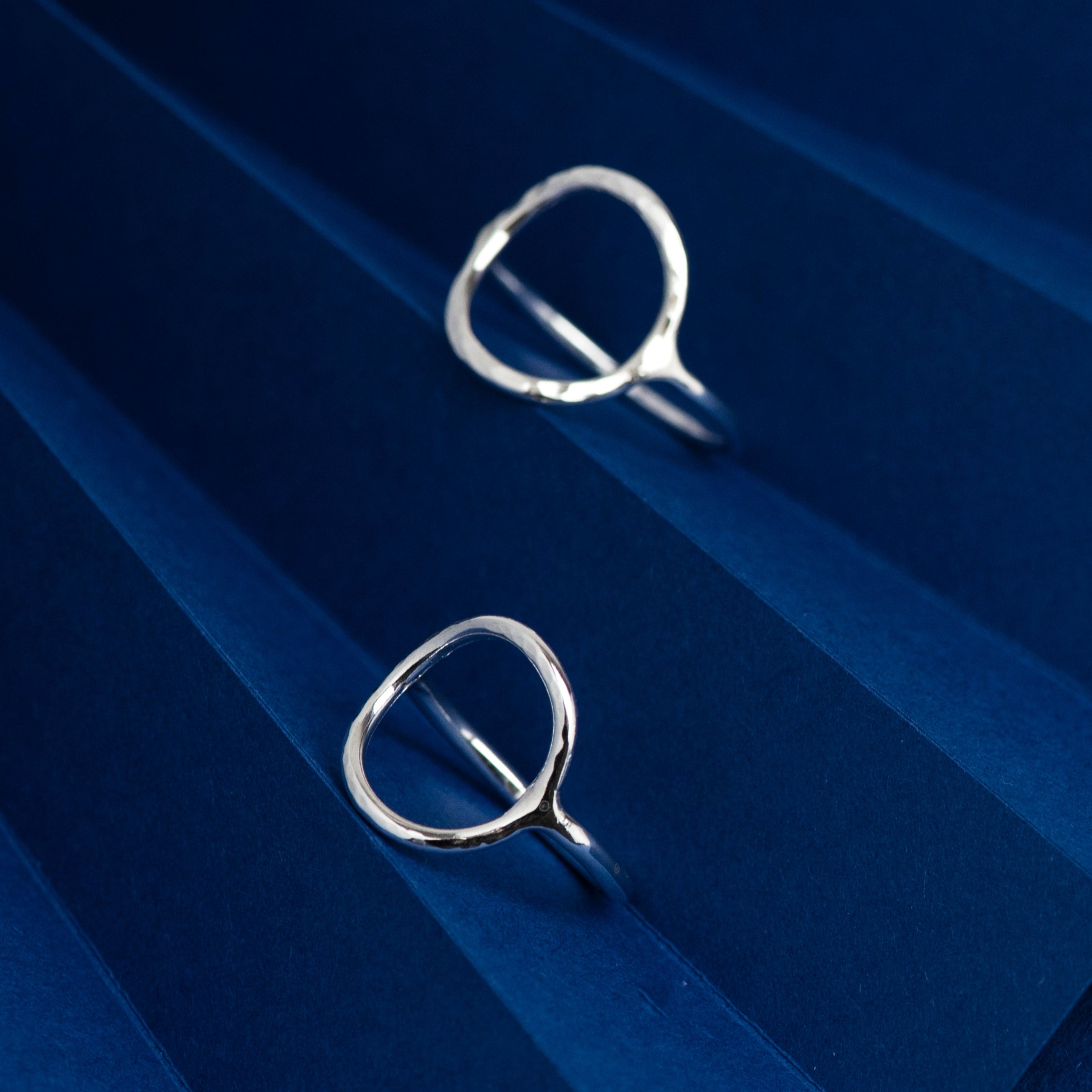 Textured open circle rings in silver. Designed and handmade by Hannah Weston, UK.