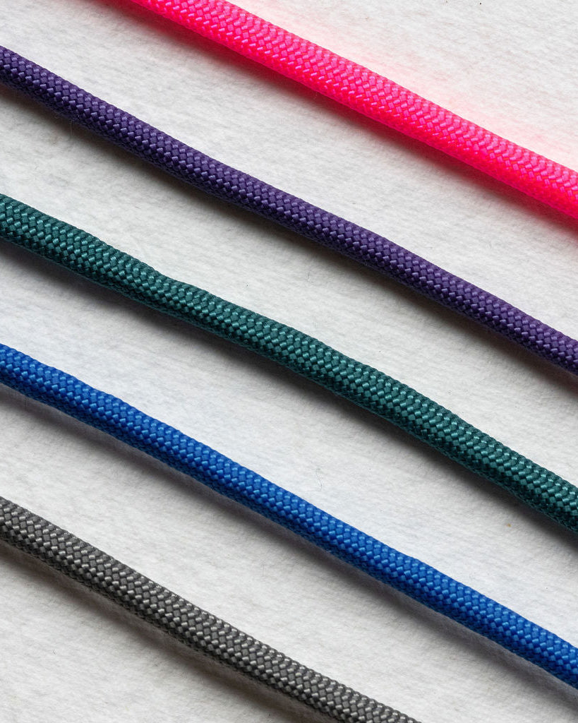 Set of colorful ropes on a textured white background