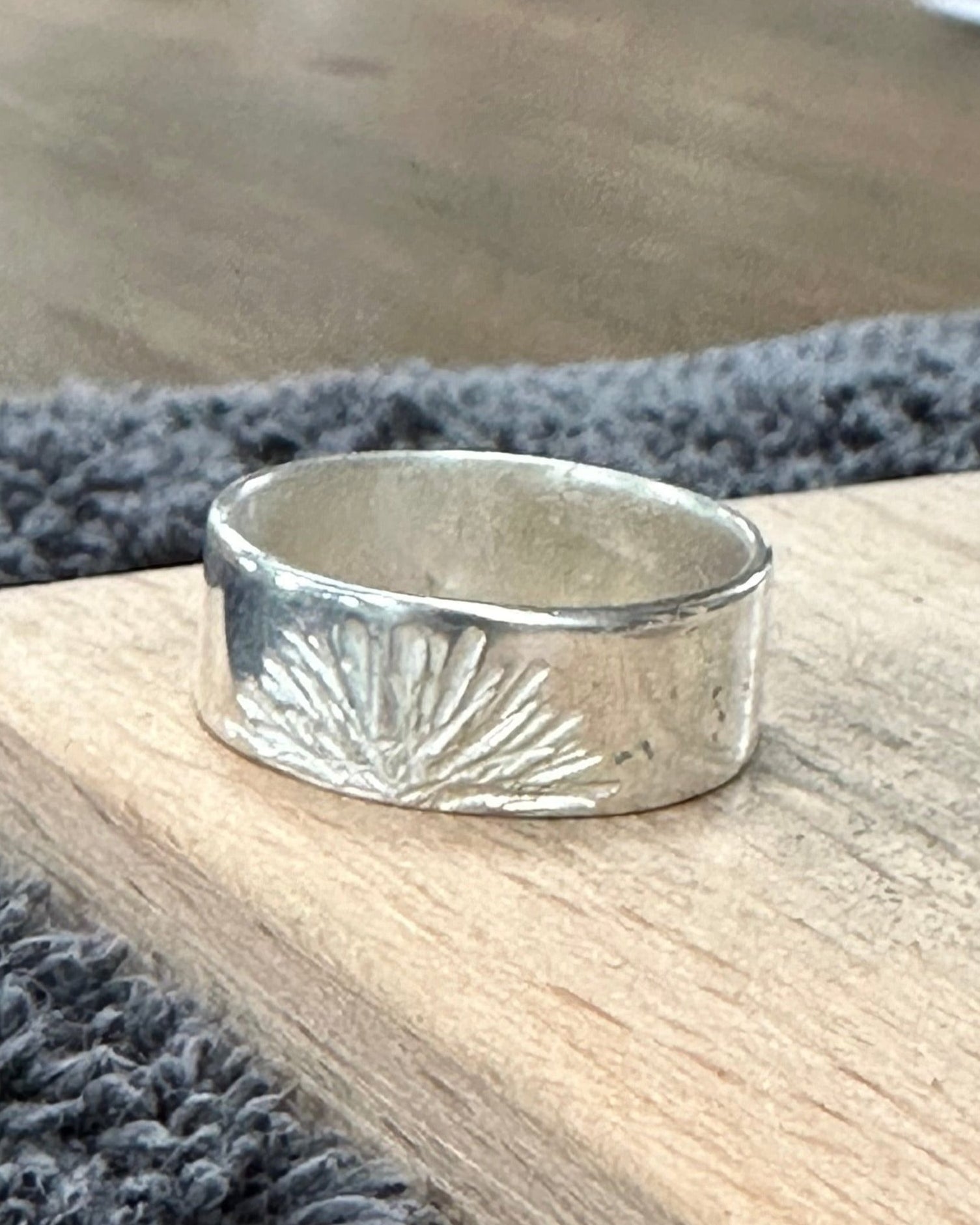 Sunburst textured silver ring made by a workshop student.