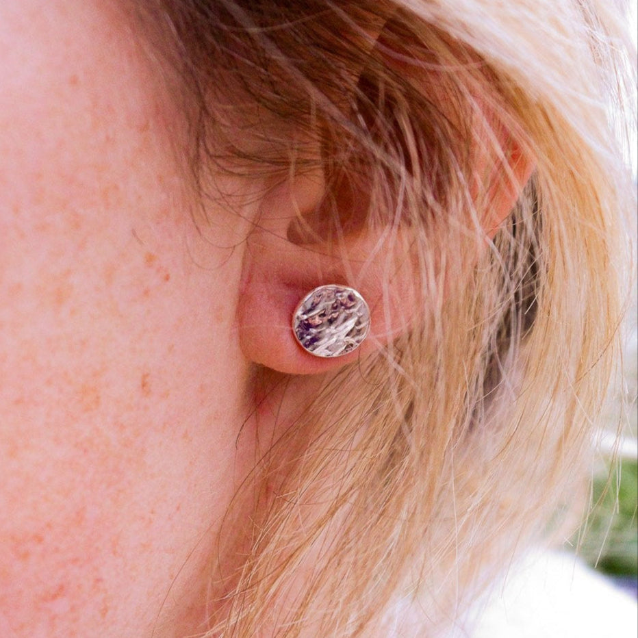 Sterling silver, circular studs featuring the texture of real tree bark by Hannah Weston.