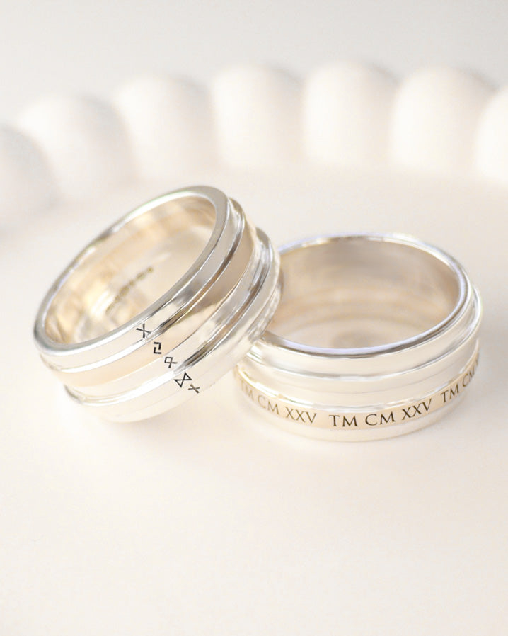 Gold and silver rings with custom engraved Runes and Roman Numerals. Commission by Hannah Weston, UK.