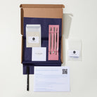 Ring-making kit with tools, materials, and instructions on a white background