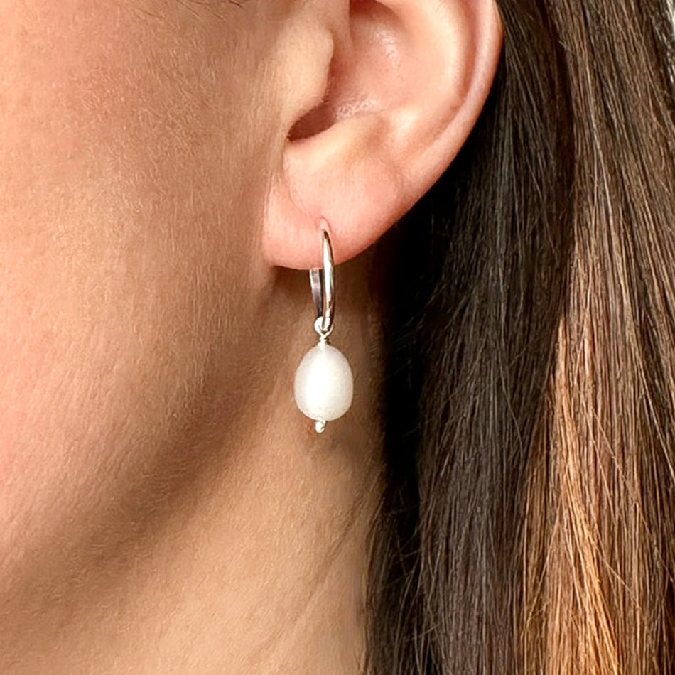 Freshwater pearl and sterling silver hoop earrings by Hannah Weston Jewellery, York.