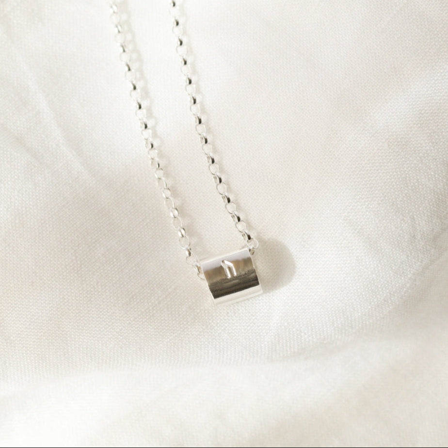 Sterling silver bead necklace stamped with a Nordic (Viking) Rune by Hannah Weston.
