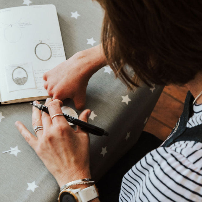 Hannah Westondesigning a bespoke pendant.