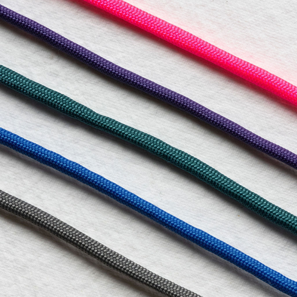 Set of colorful ropes on a textured white background