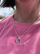 Sterling silver open circle necklace with engraved message by Hannah Weston.