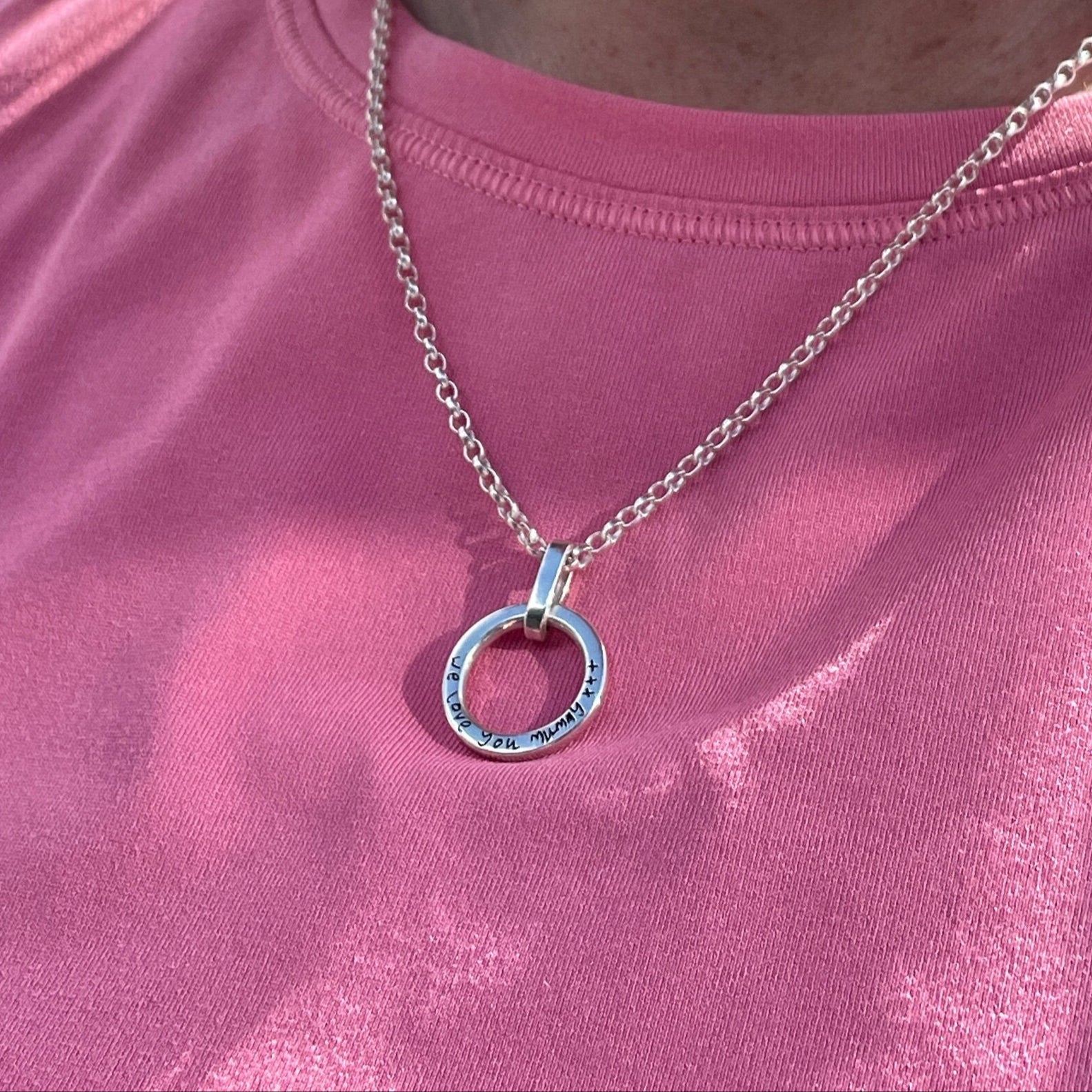Sterling silver open circle necklace with engraved message by Hannah Weston.